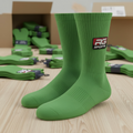 Green custom cotton crew socks with personalised RG Sports logo